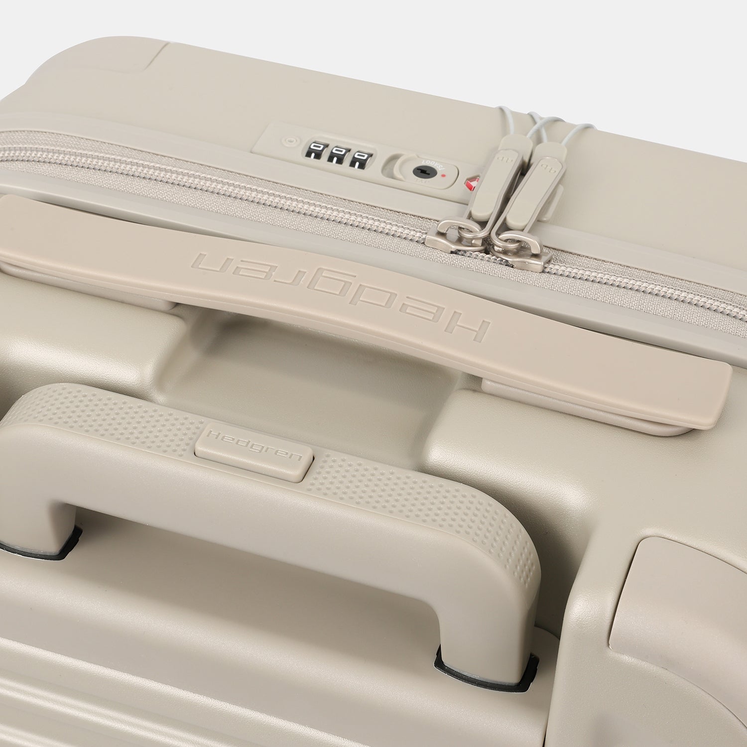 Close-up top view of the Hedgren Raku Yuno Front Pocket Luggage in Grey, showcasing the expandable and carry handles. Shop Online at Mosafer Qatar