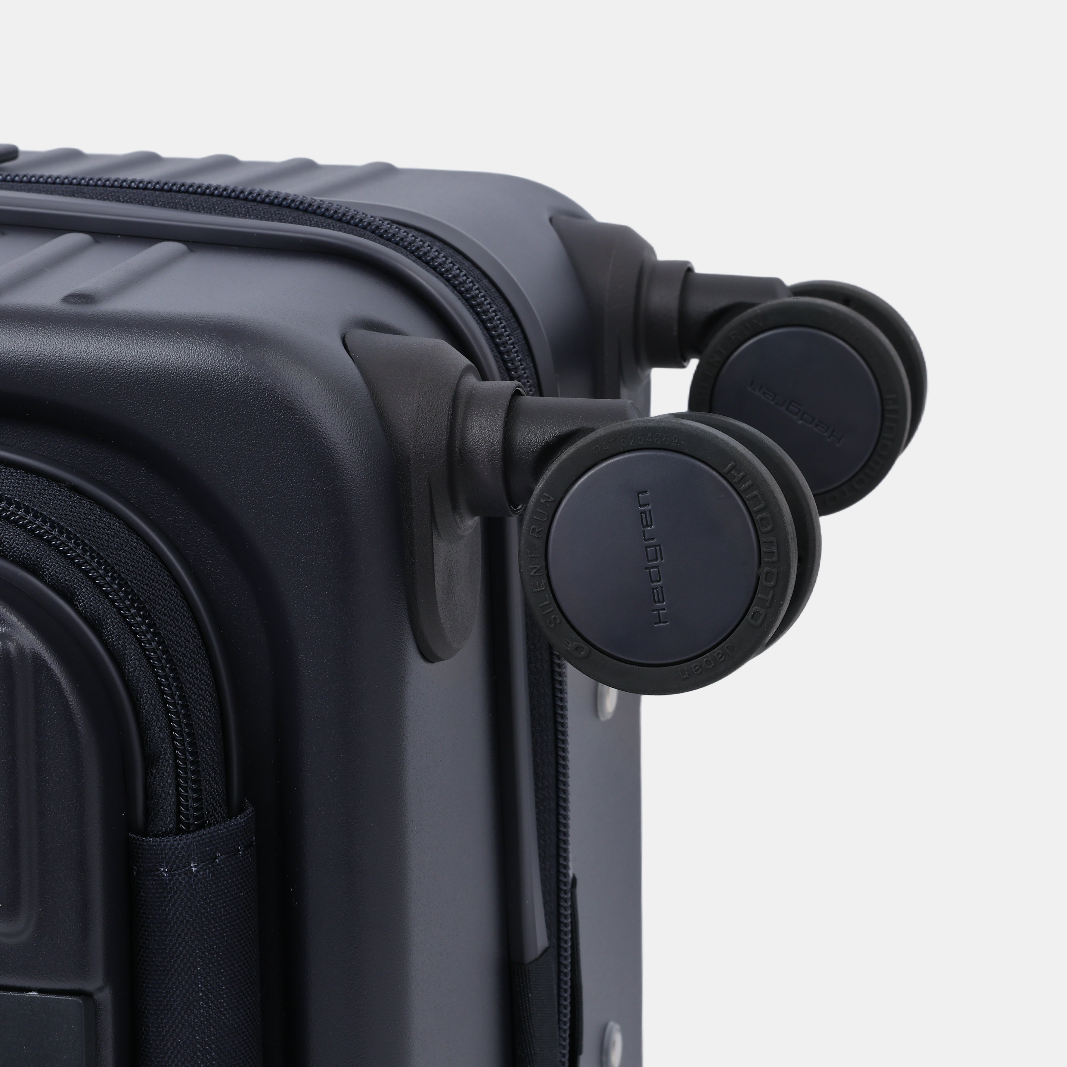 Close-up wheels view of the Hedgren Raku Yuno Front Pocket Luggage in Blue, showcasing the spinner wheels. Shop Online at Mosafer Qatar