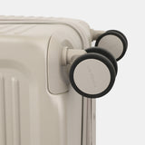 Close-up wheels view of the Hedgren Raku Yuno luggage in Grey, showcasing the spinner wheels. Available for Online Purchase