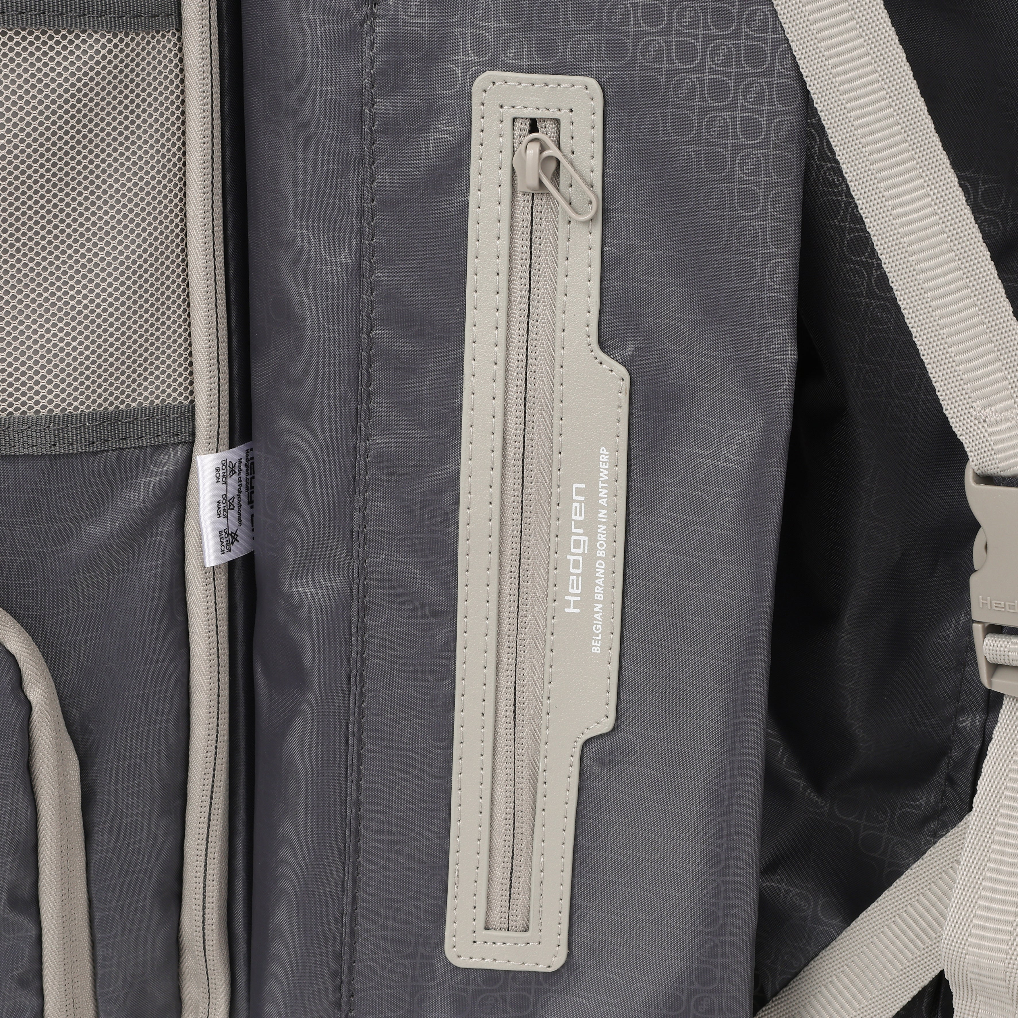 Close-up zipper view of the Hedgren Raku Yuno Front Pocket Luggage in Grey, showcasing the inside zipper and brand name. Shop Online at Mosafer Qatar