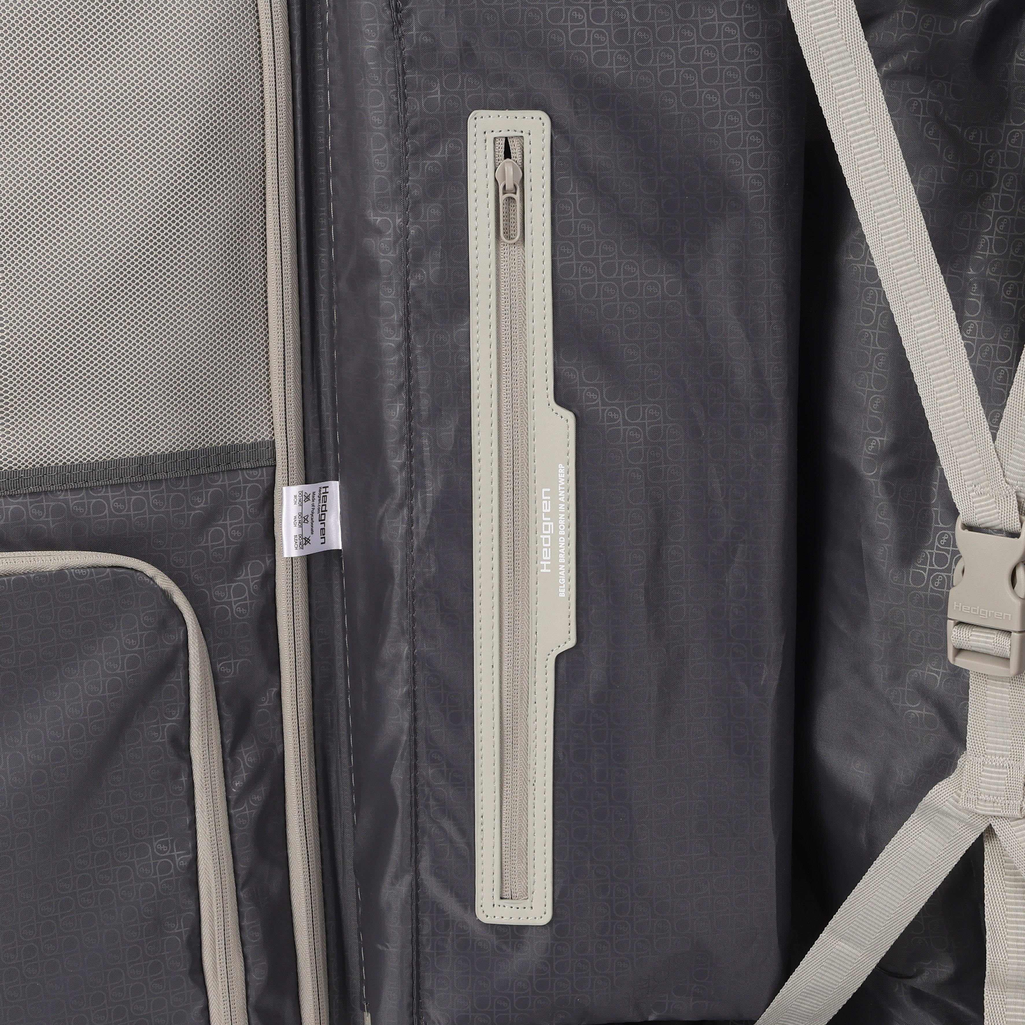 Inside close-up view of the Hedgren Raku Yuno luggage in Grey, showcasing the belt and pocket. Available for Online Purchase