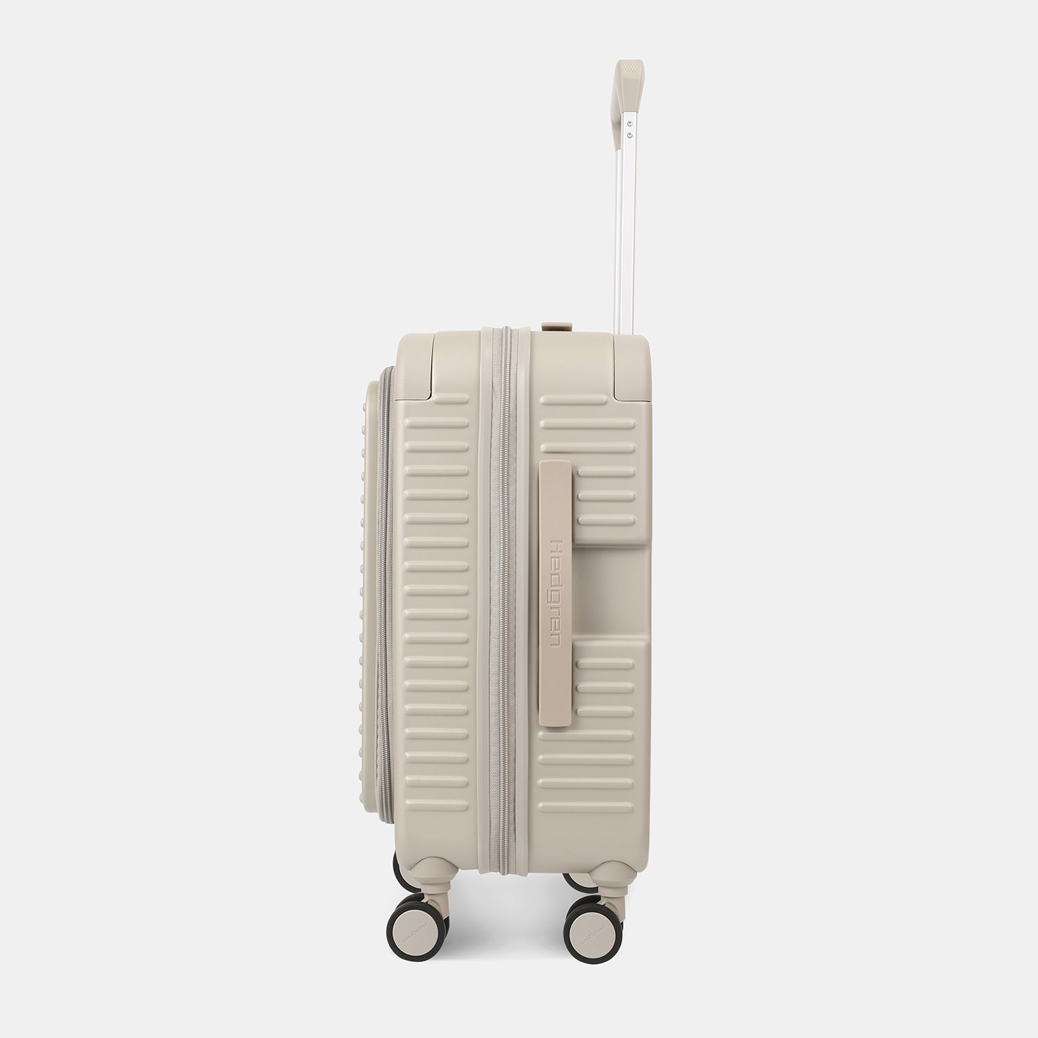 Side view of the Hedgren Raku Yuno Front Pocket Luggage in Grey, showcasing the textured hard shell and expandable zipper detail. Shop Online at Mosafer Qatar