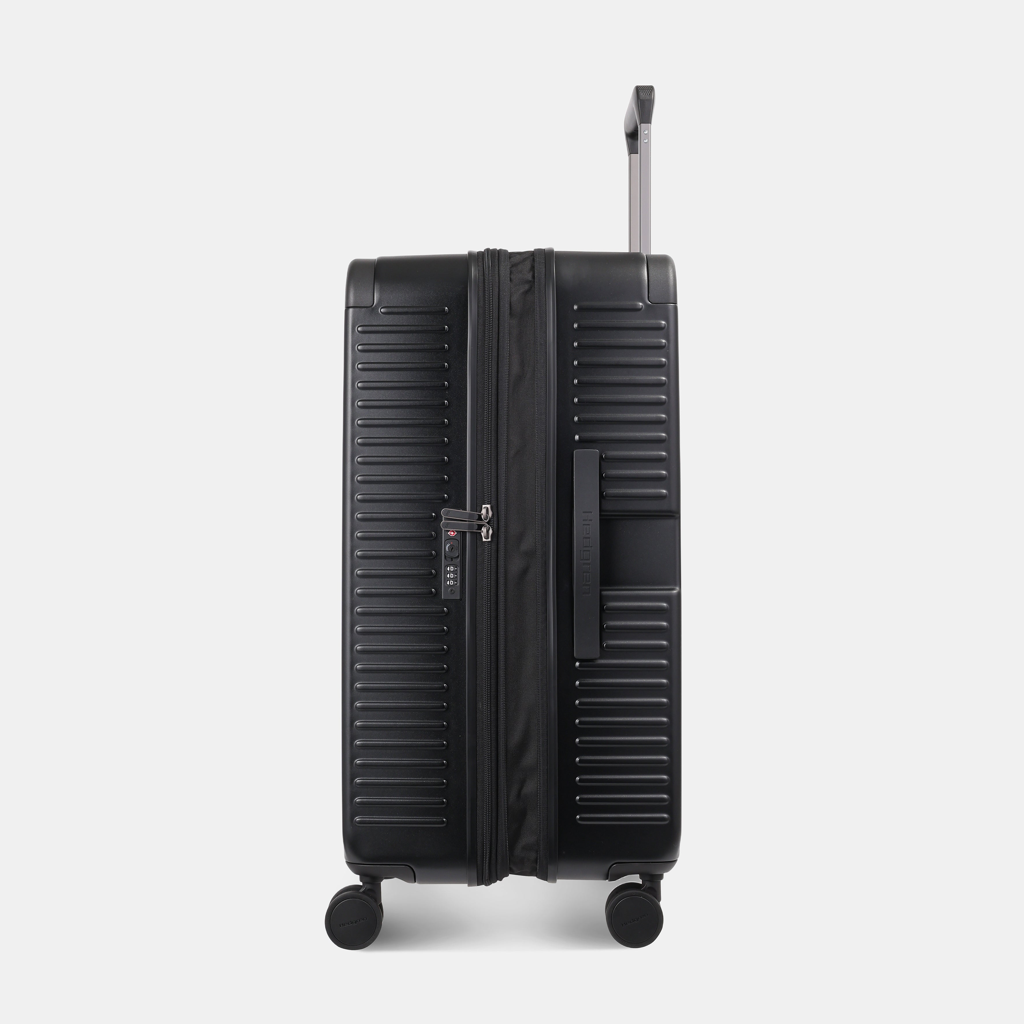 Side view of the Hedgren Raku Yuno luggage in Black, showcasing the textured hard shell and expandable zipper detail. Available for Online Purchase